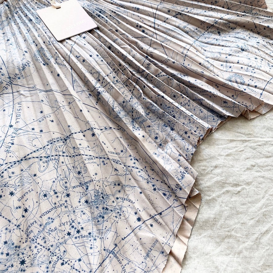 CELESTIAL PLEATED SHORT SKIRT